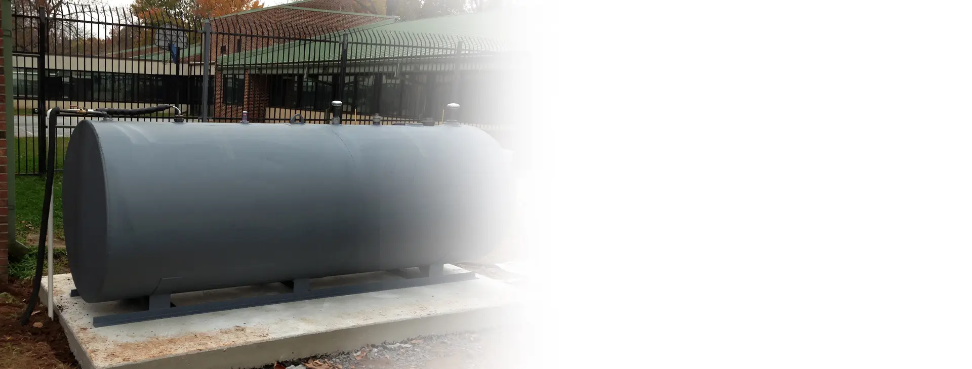 http://a%20large%20above%20ground%20oil%20tank%20outside%20of%20a%20facility%20in%20Downingtown,%20PA,%20in%20need%20of%20oil%20tank%20services